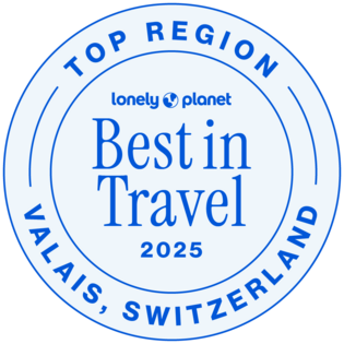 Der umlaufende Text lautet Top Region und Valais, Switzerland; feine blaue Kreise fassen die Schrift ein.